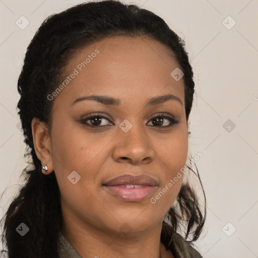 Joyful black young-adult female with long  brown hair and brown eyes