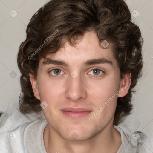 Joyful white young-adult male with medium  brown hair and green eyes