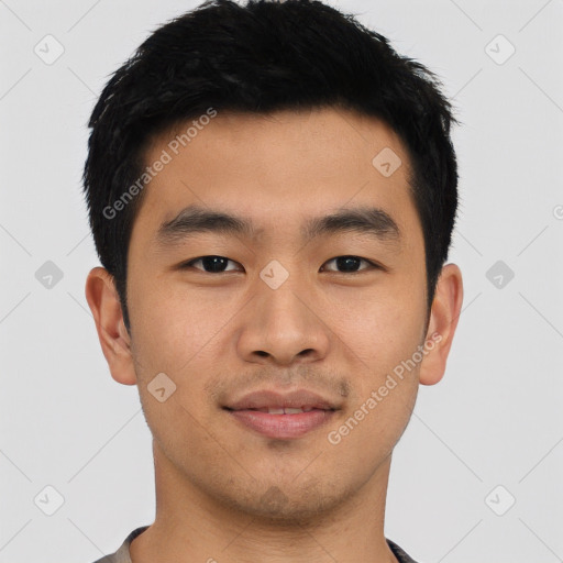 Joyful asian young-adult male with short  black hair and brown eyes