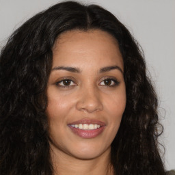 Joyful latino young-adult female with long  brown hair and brown eyes