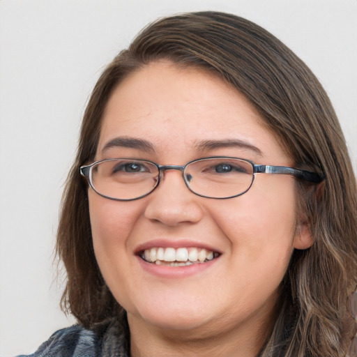 Joyful white young-adult female with medium  brown hair and blue eyes