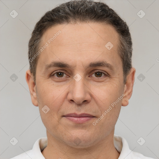 Joyful white adult male with short  brown hair and brown eyes