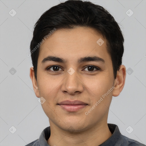 Joyful latino young-adult male with short  black hair and brown eyes