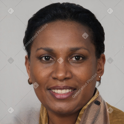 Joyful black adult female with short  brown hair and brown eyes