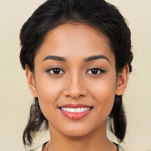 Joyful latino young-adult female with medium  black hair and brown eyes