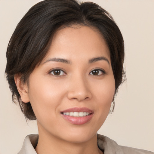 Joyful white young-adult female with medium  brown hair and brown eyes