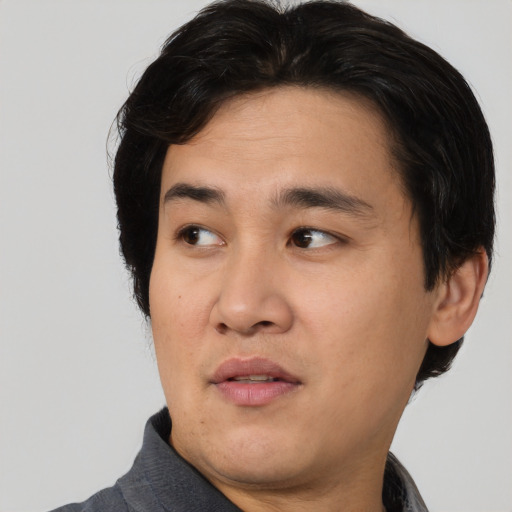 Neutral asian young-adult male with short  brown hair and brown eyes