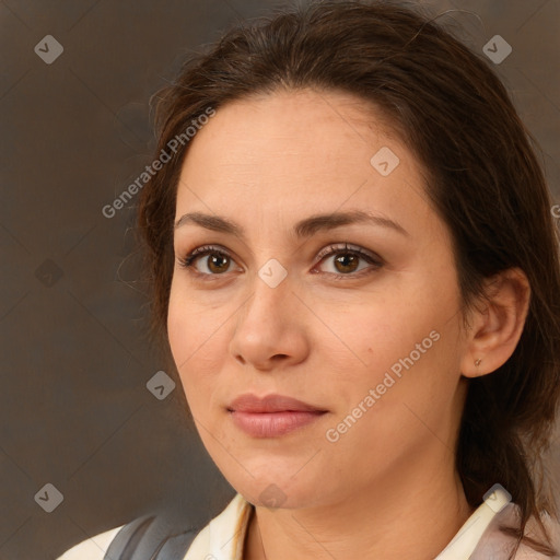 Joyful white adult female with medium  brown hair and brown eyes