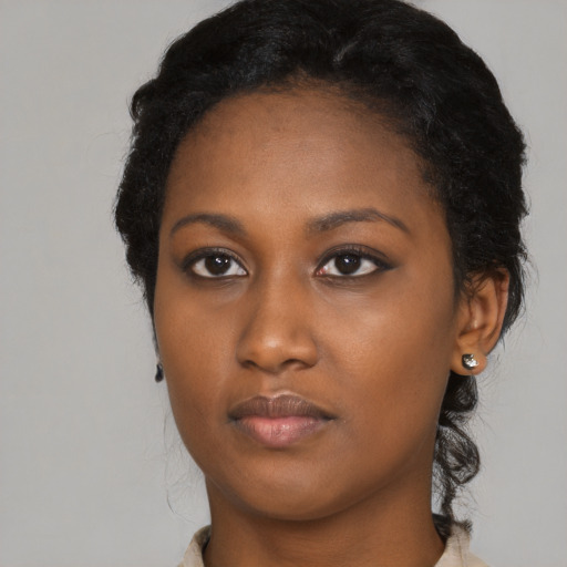 Neutral black young-adult female with long  black hair and brown eyes