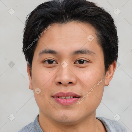 Joyful asian young-adult male with short  brown hair and brown eyes