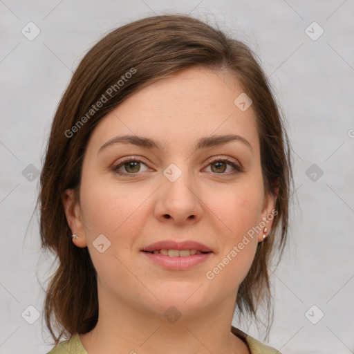 Joyful white young-adult female with medium  brown hair and green eyes