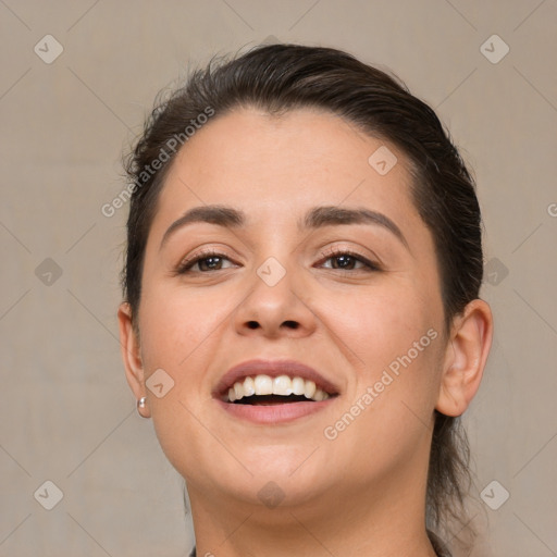 Joyful white young-adult female with medium  brown hair and brown eyes