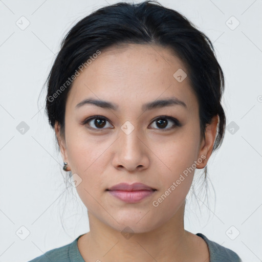 Joyful latino young-adult female with medium  black hair and brown eyes