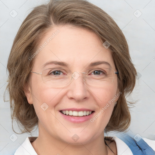 Joyful white adult female with medium  brown hair and blue eyes