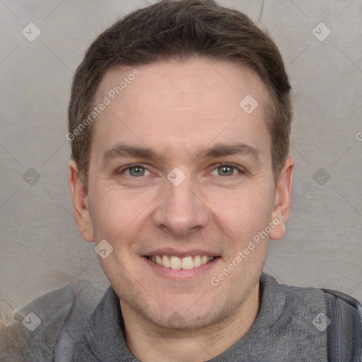 Joyful white adult male with short  brown hair and grey eyes