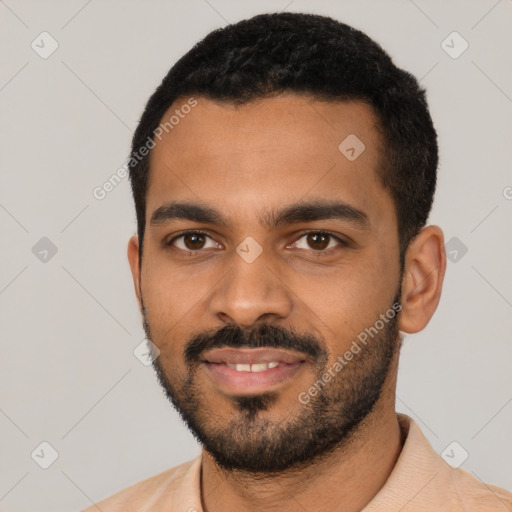 Joyful black young-adult male with short  black hair and brown eyes