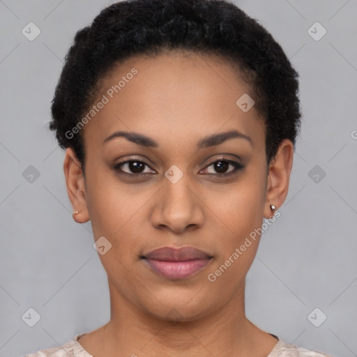Joyful black young-adult female with short  black hair and brown eyes