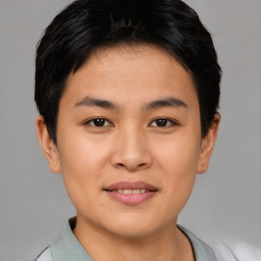 Joyful asian young-adult female with short  brown hair and brown eyes