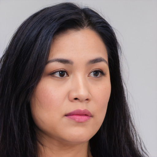 Neutral asian young-adult female with long  brown hair and brown eyes