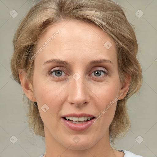 Joyful white adult female with medium  brown hair and grey eyes