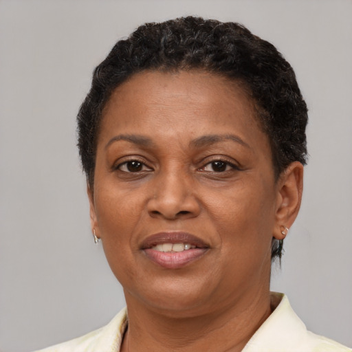 Joyful latino adult female with short  brown hair and brown eyes