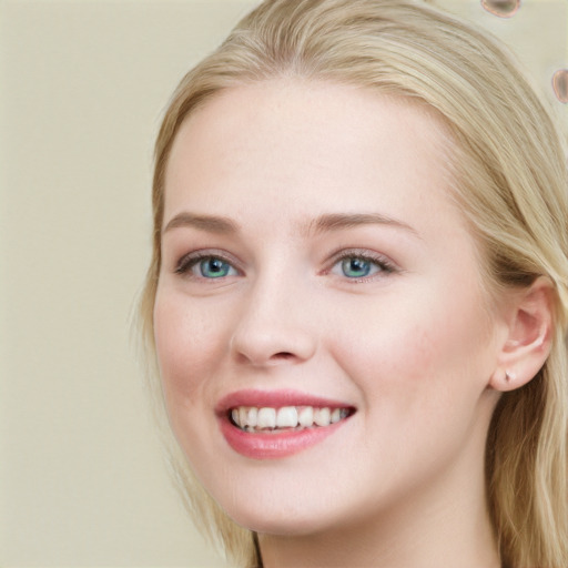 Joyful white young-adult female with long  brown hair and blue eyes