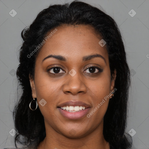 Joyful black young-adult female with long  brown hair and brown eyes