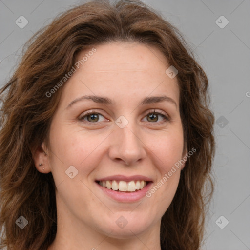 Joyful white young-adult female with long  brown hair and green eyes