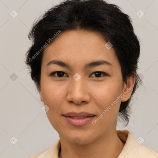 Joyful latino adult female with medium  brown hair and brown eyes