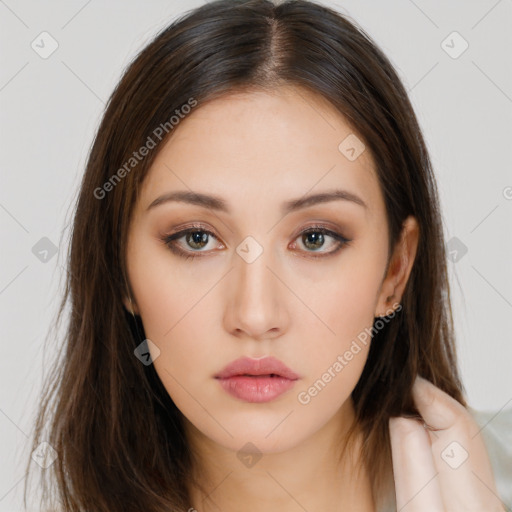 Neutral white young-adult female with long  brown hair and brown eyes