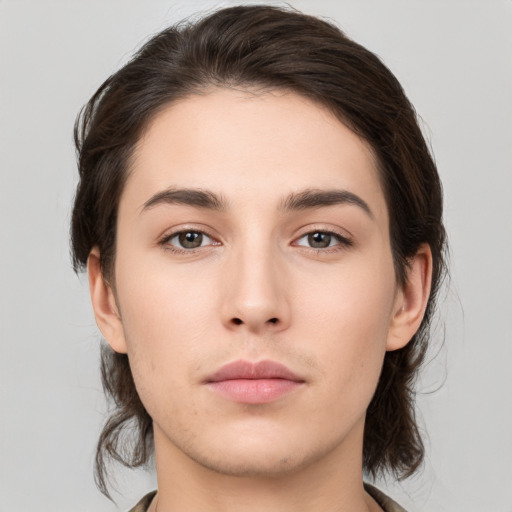 Neutral white young-adult female with medium  brown hair and brown eyes