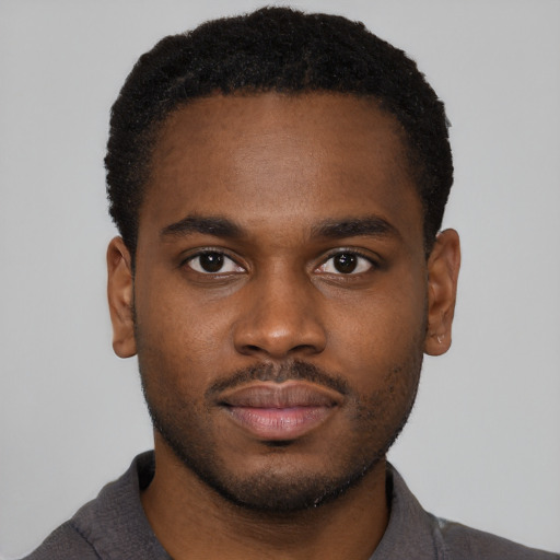 Neutral black young-adult male with short  brown hair and brown eyes