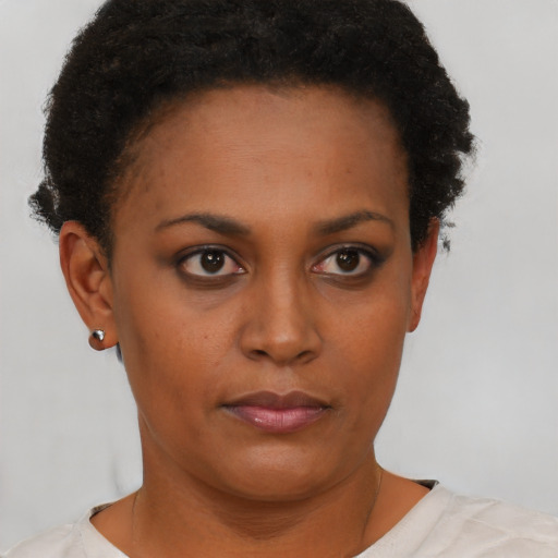 Neutral black young-adult female with short  brown hair and brown eyes