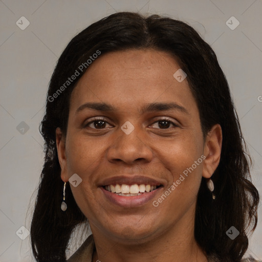 Joyful black adult female with medium  brown hair and brown eyes