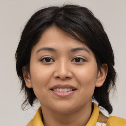 Joyful asian young-adult female with medium  brown hair and brown eyes