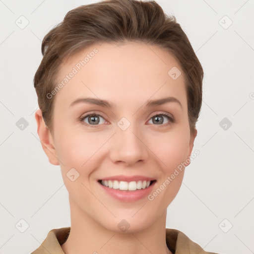 Joyful white young-adult female with short  brown hair and grey eyes