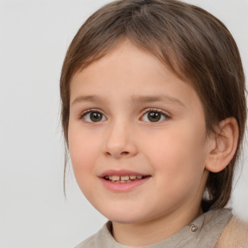 Joyful white child female with medium  brown hair and brown eyes