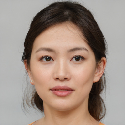 Neutral asian young-adult female with medium  brown hair and brown eyes