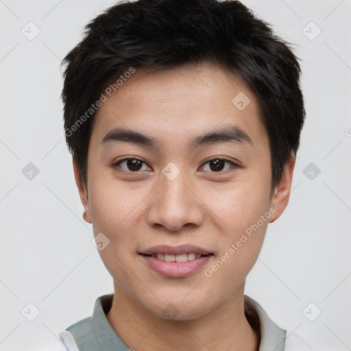 Joyful asian young-adult male with short  brown hair and brown eyes