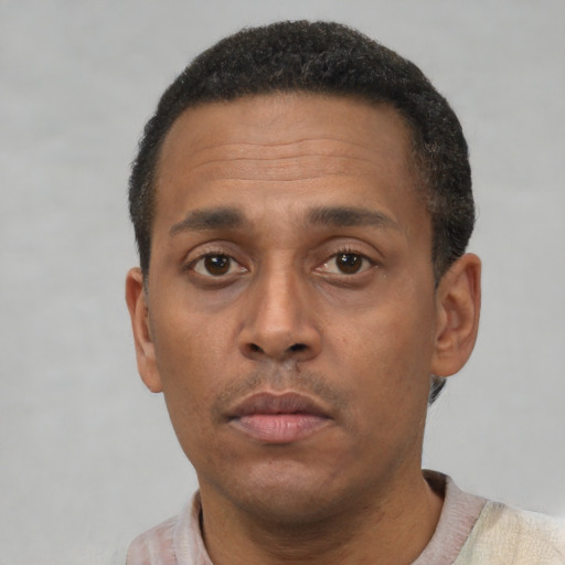 Neutral latino adult male with short  black hair and brown eyes