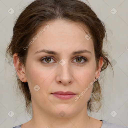 Joyful white young-adult female with medium  brown hair and green eyes