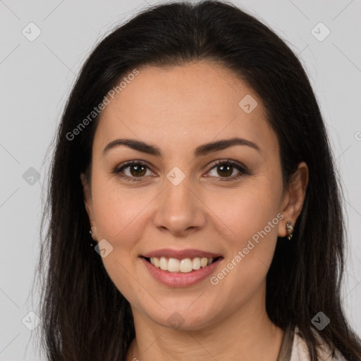 Joyful white young-adult female with long  brown hair and brown eyes