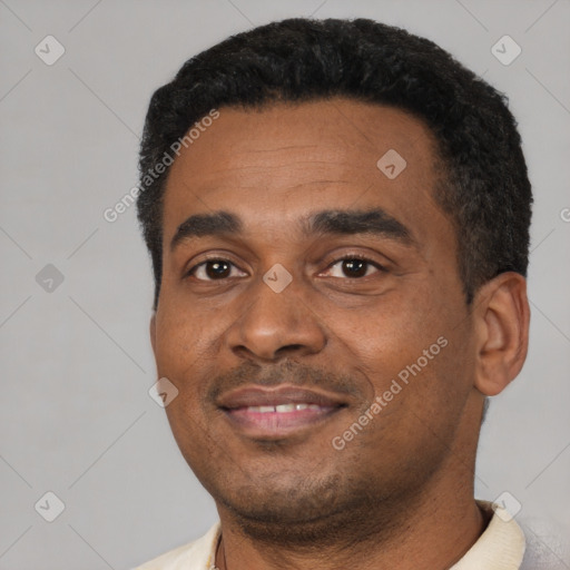 Joyful latino adult male with short  black hair and brown eyes