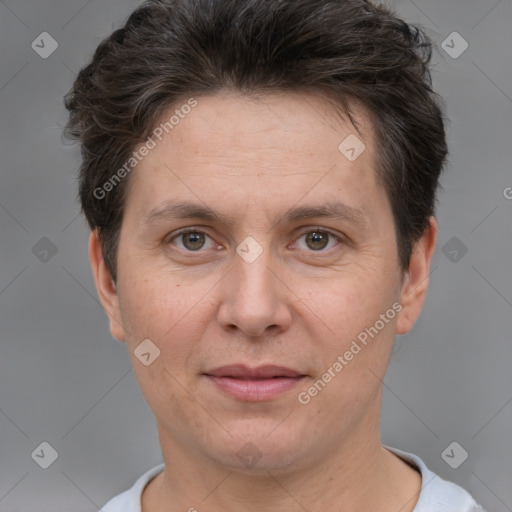 Joyful white adult female with short  brown hair and brown eyes