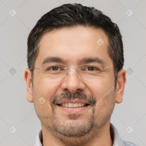 Joyful white adult male with short  brown hair and brown eyes