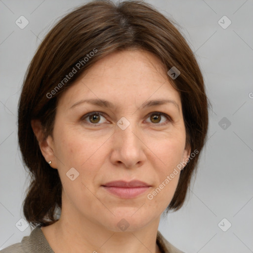 Joyful white adult female with medium  brown hair and grey eyes