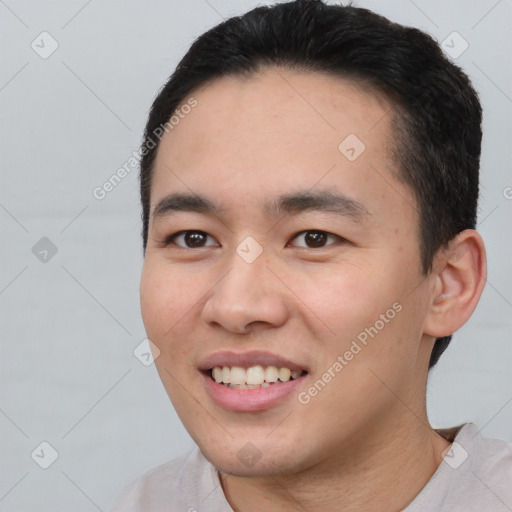 Joyful white young-adult male with short  black hair and brown eyes