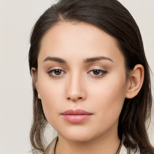 Neutral white young-adult female with long  brown hair and brown eyes