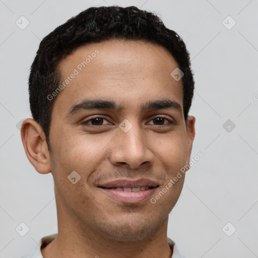 Joyful latino young-adult male with short  brown hair and brown eyes