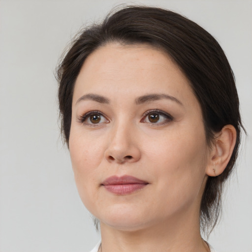 Joyful white young-adult female with medium  brown hair and brown eyes